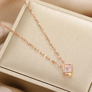 Titanium steel square zircon pendant necklace on luxury champagne silk display
