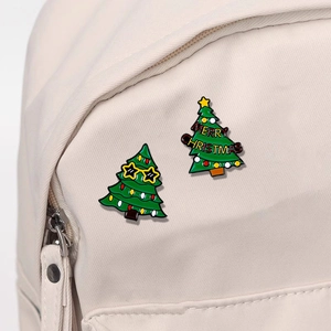 Cute enamel Christmas tree badges with sunglasses and Merry Christmas text on backpack
