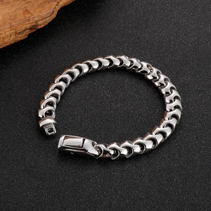 Minimalist silver keel chain bracelet with square clasp on rustic wood and dark stone
