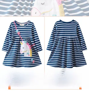 Detailed close-up of blue white striped dress with unicorn embroidery and floral accents