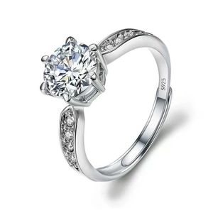 Close-up of S925 sterling silver ring with round-cut moissanite and side zircon stones