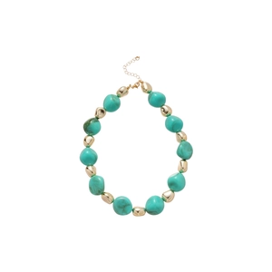 Irregular green acrylic beads and gold metallic bead necklace set on a white background