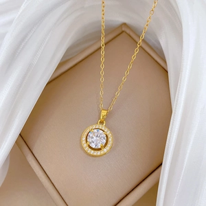 Titanium steel halo necklace with circular cubic zirconia on beige jewelry box