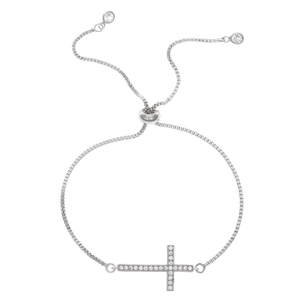 Adjustable silver cross bracelet with sparkling zircons on a white background