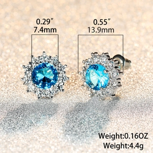 Detail view showing snowflake stud earring dimensions of 13.9mm with 7.4mm blue zircon