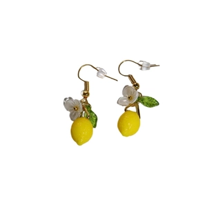 Creative yellow lemon drop earrings with white flower and green leaf charms