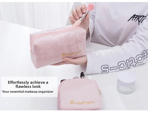 Close-up of pink velvet makeup bags with gold zippers and Beautyforyou embroidery