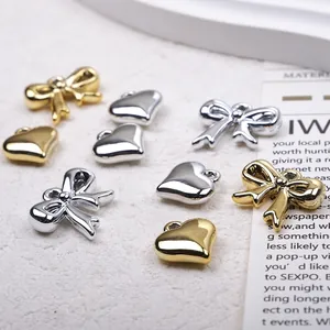 Polished metal heart and bow jewelry pendants for DIY necklaces in gold and silver