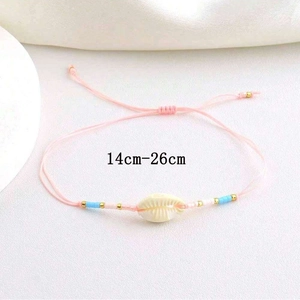 Adjustable pink woven bracelet featuring a shell center and 14cm-26cm sizing info