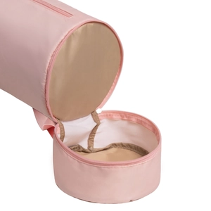 Detail of pink yoga mat bag showing interior beige lining and elastic storage straps