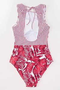 Detailed back view of striped halter bikini with tropical leaf print and open back cutout