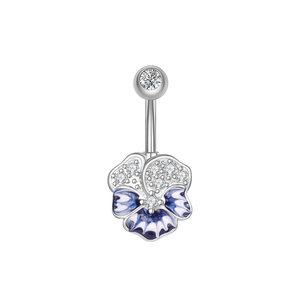 Macro detail of silver navel piercing featuring blue enamel clover and sparkling zircons