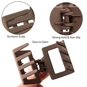 Detail view of large matte brown square hair claw clip with strong spring and smooth teeth