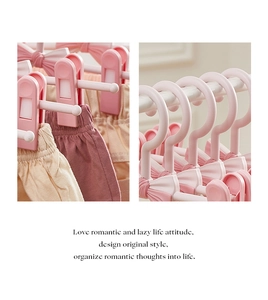 Close-up of pink bow adjustable pants hanger with non-slip clips and strong spring grips