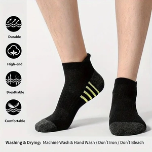 Detail of breathable mesh knit sports socks with reinforced gray toe and yellow stripe accents