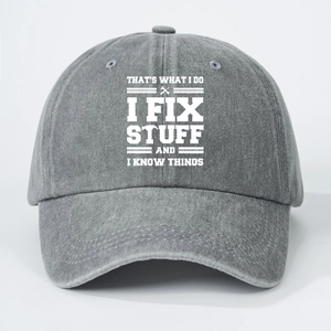 Macro detail of the IF IX STUFF slogan print on gray washed denim baseball cap