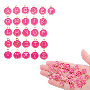 Detail of 26 rose pink enamel letter charms for DIY necklace and bracelet making