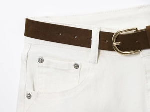 Detail of high waist white denim jeans with dark brown leather belt and gold buckle