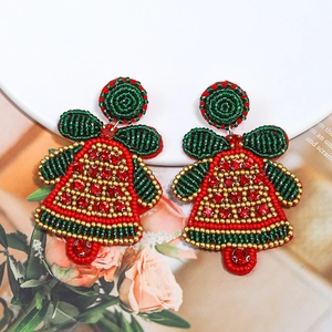 Detailed view of handmade beaded Christmas bell earrings with red and green sequins