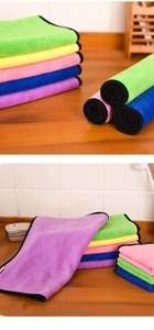 Microfiber cleaning cloths in multiple colors with black piping for household tasks