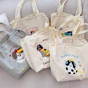 Flat lay of multiple canvas tote bags with cute 3D towel embroidered animal designs