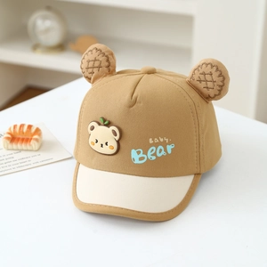 Detail of baby bear baseball cap with plush ears and contrast stitching design