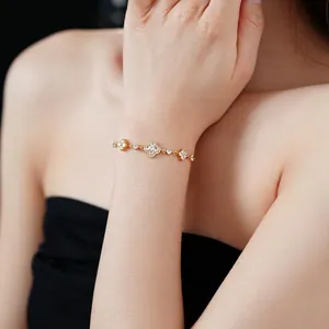 Elegant gold plated flower bracelet with sparkling cubic zirconia stones for women
