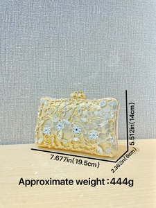 Golden luxury evening clutch bag with floral rhinestone patterns and metal frame