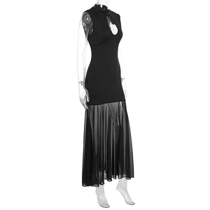 Detail of sheer mesh panel and cutout design on a black slim fit dress