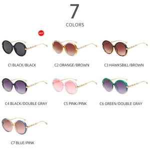 Detailed grid showing seven stylish oversized round sunglasses with gold twisted metal temples