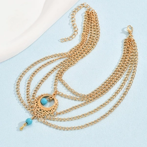 Bohemian gold layered turquoise anklet with intricate hollow droplet charms for women