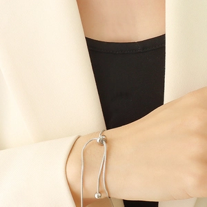 Minimalist adjustable silver snake bone bracelet for women with flexible sliding clasp
