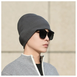 Detailed view of dark grey ribbed knit texture and soft lining on mens winter beanie hat