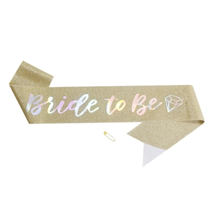 Glittering gold Bride to Be party sash with holographic lettering and safety pin set