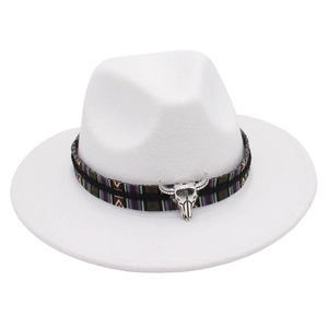 Close-up of white wool fedora with ethnic woven band and silver bull skull ornament
