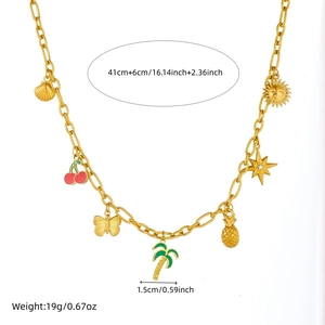 Gold charm necklace with tropical pendants like coconut tree, pineapple, and cherry charms