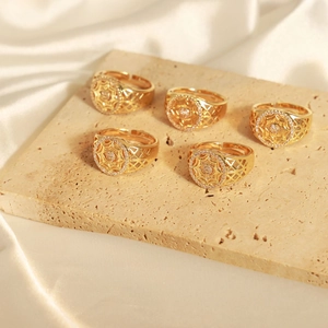 Five-piece set of gold geometric hollow rings with zircon star designs on stone