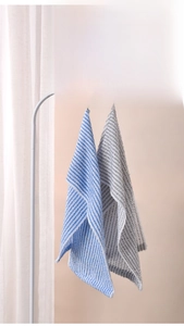 Detail of blue and grey striped antibacterial back scrubber towels hanging on a rack