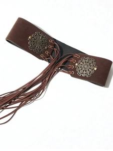 Close-up of brown suede corset belt with metal ring hardware and long tassel ties