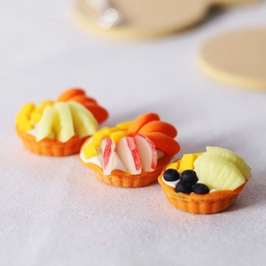 Miniature dollhouse fruit tart set with strawberry, mango and blueberry on mini crust