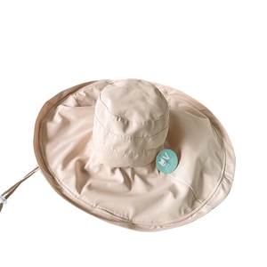 Beige wide brim sun hat with UPF 50+ protection and adjustable drawstring for women