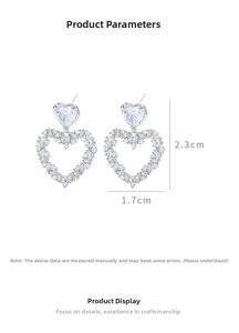 Detailed size view of silver heart earrings with pavé zircon, dimensions 2.3cm by 1.7cm