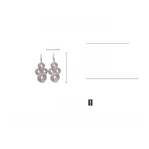 Macro detail of silver pleated spiral drop earrings showing 3cm width and 6.8cm length