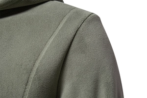 Macro detail of olive green fleece hoodie showing shoulder seams and soft texture