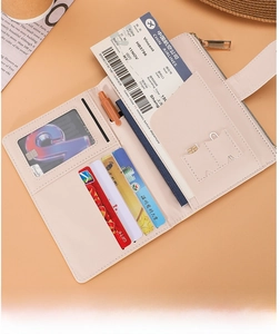 Detail view of pink RFID travel wallet interior with card slots and boarding pass pocket