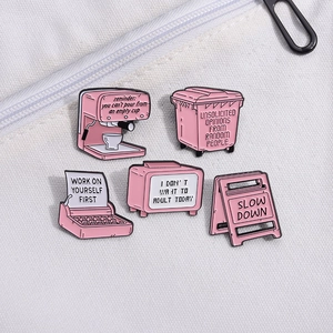 Set of 5 pink enamel metal pins featuring vintage typewriter and creative sign designs