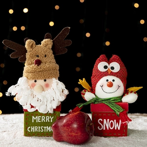 Christmas gift boxes with Santa and Snowman plush lids in festive red and green colors