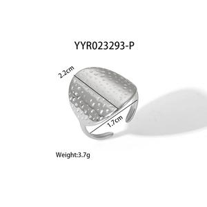 Detail view of irregular textured adjustable stainless steel ring measuring 2.2x1.7cm