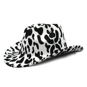 Close-up of cow print felt fabric on a western cowboy hat with black and white spots