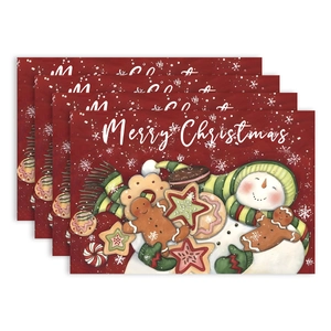 Set of 4 Christmas placemats with snowman and gingerbread man on dark red background